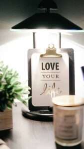 Home page Goodness of Serenity. Love your life sign with candle,